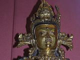 British Museum Top 20 Buddhism 16-2 Vajrasattva Close Up 16. Vajrasattva � Nepal, 15C AD, 52cm high. Here is a close up of Vajrasattva holding the vajra and bell in his hands, has elaborate jewelry, and is inset with semi-precious stones. In Vajrasattva's crown is the seated figure of the Akshobhya, the Tathagata Meditation Buddha of the East.